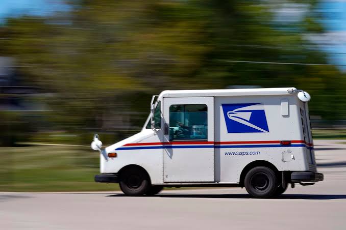 USPS Grumman LLV mail truck on route